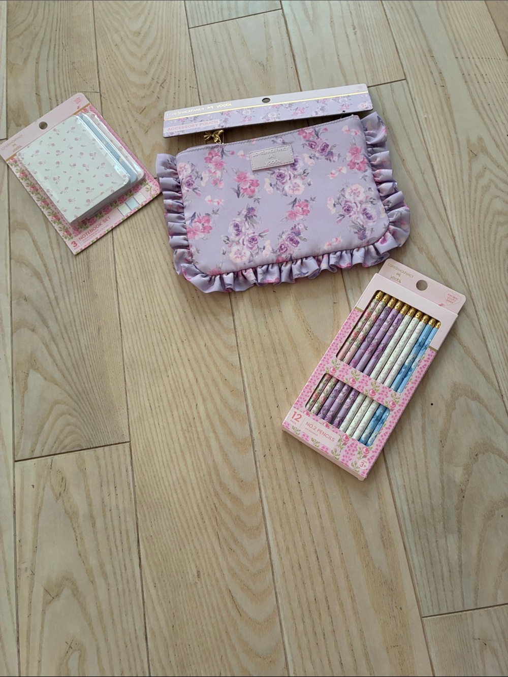 LoveShackFancy pastel floral pencils, pencil case and three pack of notebooks